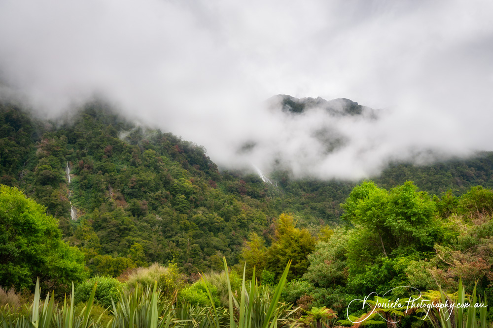 Mountain view covered in the mist at Haast Pass 